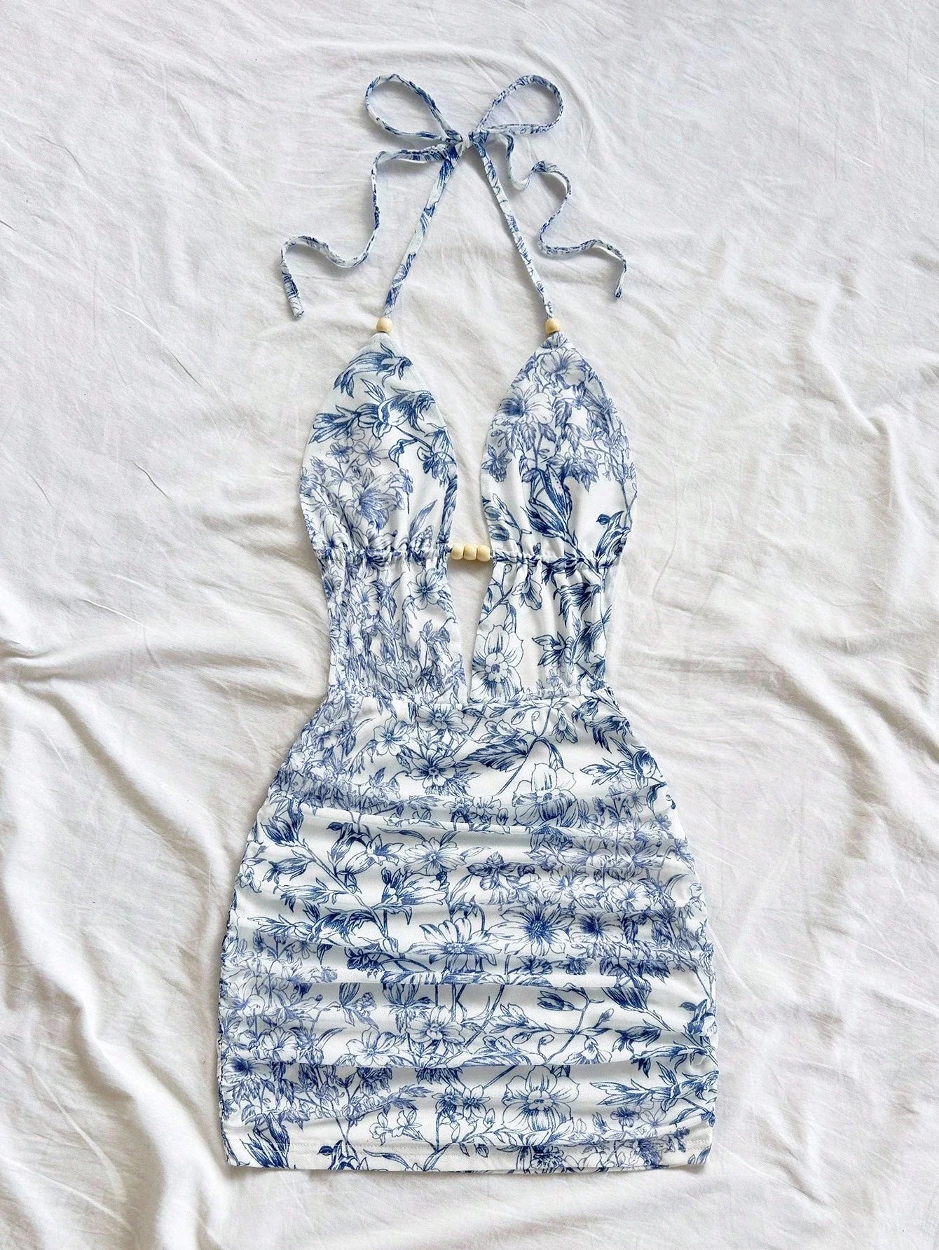 Soleia Women's Vacation Blue & White Floral Print Deep V Neck Tie Strap Backless Ruched Bodycon Mini Dress, Suitable For Party,